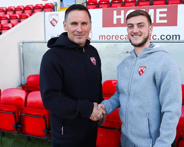 Morecambe boss Ged Brannan and Charlie Brown after the striker penned a new deal with the Shrimps Picture: Morecambe FC