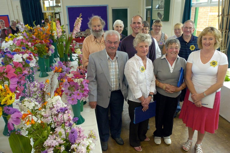 Chairman of Galgate Gaslight Floral and Horticultural Society Carl Boor (centre) with judges and officials at the annual exhibition at Ellel St John's School in 2009.