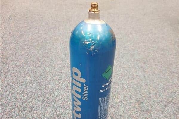A nitrous oxide canister.
