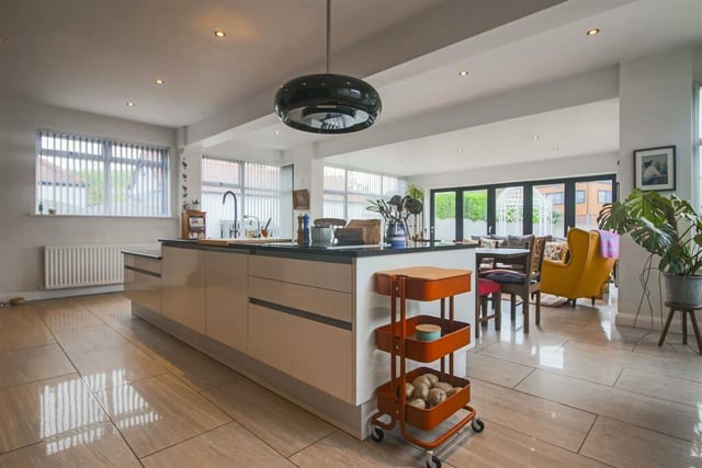 The open plan kitchen, living and dining area at the property.