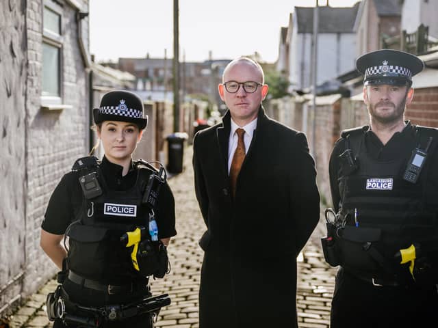 Andrew Snowden, Police and Crime Commissioner for Lancashire with police officers.
