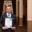 Morecambe Engineering Manager Anthony Seed receives a special award for his length of service at bus operator Stagecoach.