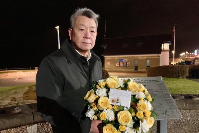 James Liu, vice-chairman of the Lancaster and Morecambe Bay Chinese Community Association, with a wreath at the memorial ceremony and vigil for the cocklers.