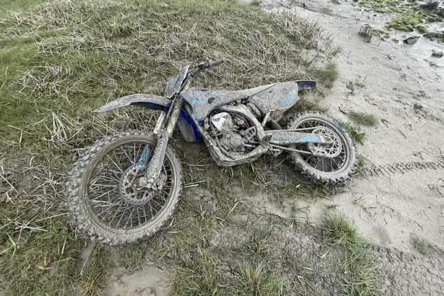 Bay Search and Rescue pulled a motocross bike out of the sand after it became stuck in the bay.