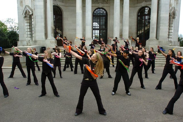 Year 8 and 9 pupils from Central Lancaster High School performing the Jai Ho Indian dance in celebration of the international Day of Dance and to celebrate the school's performing and visual arts status.  The dance was choreographed by Victoria Hubbard and the pupils performed outside the Ashton Memorial.