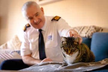 Dermot Murphy, RSPCA inspectorate commissioner,  pictured with a rescued cat.