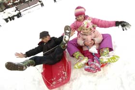 Jack Bonney, and Charlotte and Ruby Simms have fun in the snow at the Lytham Square Christmas party