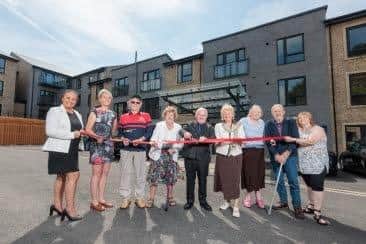 Housing 21 residents and employees celebrate the opening of Bowland View by cutting the ribbon along with Coun Linda Brockbank.