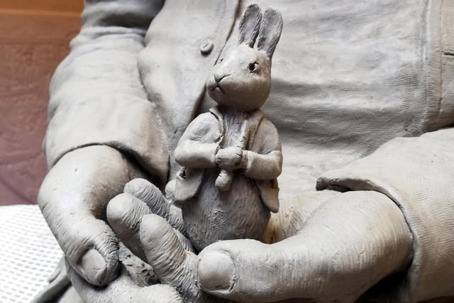 A close-up of the clay Peter Rabbit which Beatrix is holding.