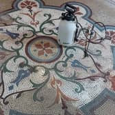 Cleaning work under way on the tiles at the Winter Gardens.