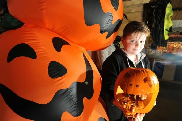 Callum Kennedy enjoys pumpkin carving and Halloween family activities at the Festival Market, Morecambe.