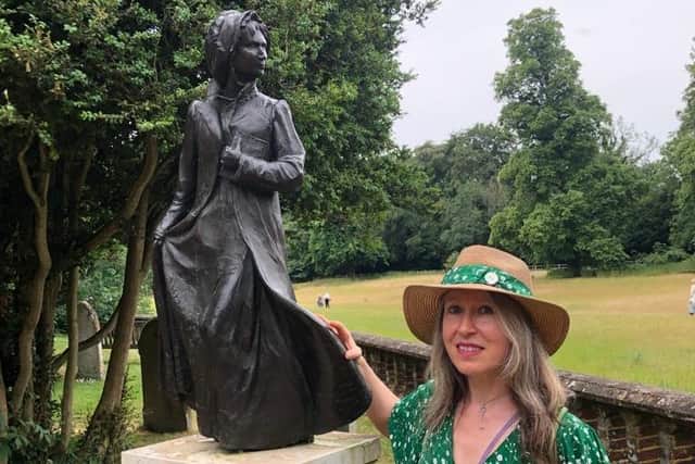 Faith Cobaine with the Jane Austen statue at St Nicholas Church, Chawton estate.