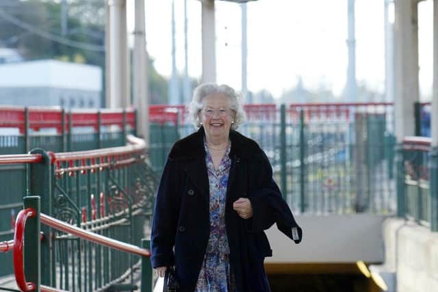 Margaret Barton, who starred in the 1945 movie Brief Encounter, walks along the platform and under the famous clock at Carnforth Station in 2003. Picture: PA Photo/Owen Humphreys.