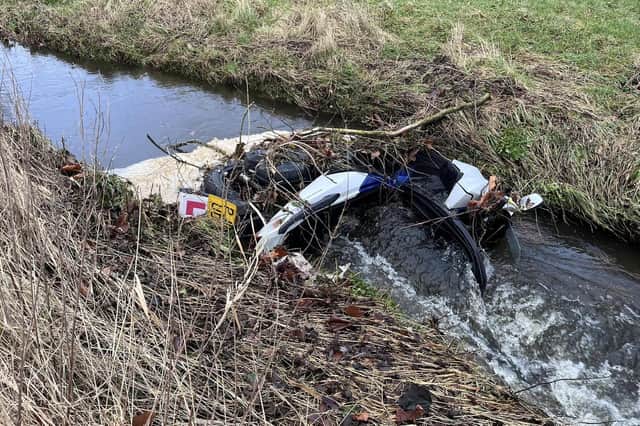 County Coun Erica Lewis shared this photo on Facebook of the dumped moped in Burrow Beck.