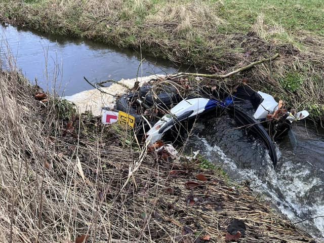 County Coun Erica Lewis shared this photo on Facebook of the dumped moped in Burrow Beck.