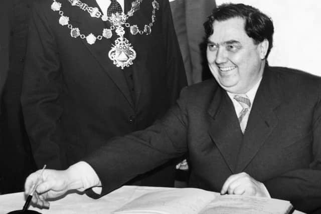 Georgy Malenkov signing the Midland Hotel's visitor book.