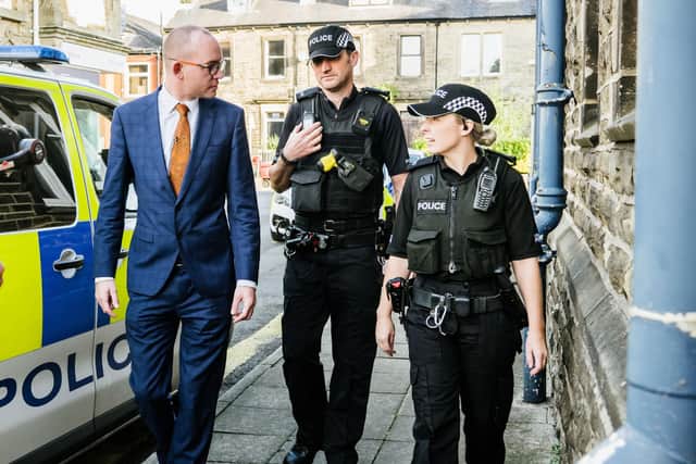 Lancashire Police and Crime Commissioner, Andrew Snowden, with officers.