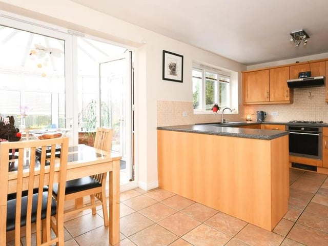 Next to the dining room is this modern, fitted kitchen/dinner. Like most rooms in the house, it will impress you with its size.