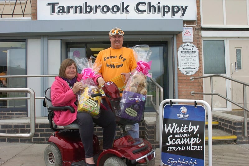 Manager of Tarnbrook Chippy in Heysham, Glen Knox and Sue Heath from Kingsway Residents Association draw the Easter egg raffle.