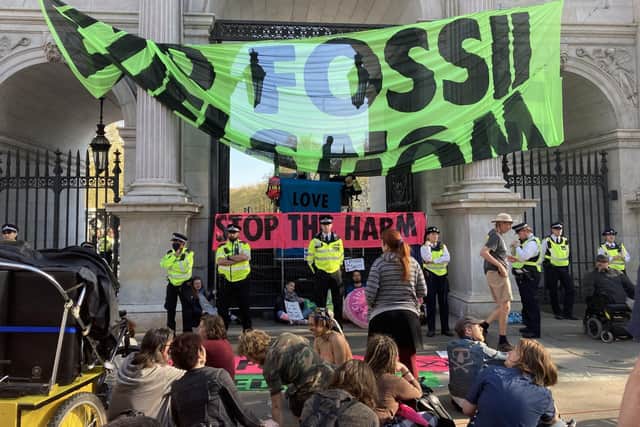 Demonstrators take part in an Extinction Rebellion protest at Marble Arch in central London. Picture date: Saturday April 16, 2022. Rebecca Speare-Cole/PA Wire