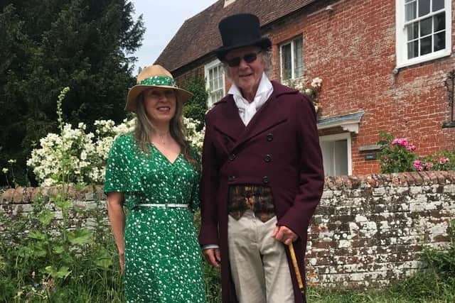 Faith Cobaine with Jeremy Knight, Jane Austen's fourth great nephew, outside Jane Austen's cottage.