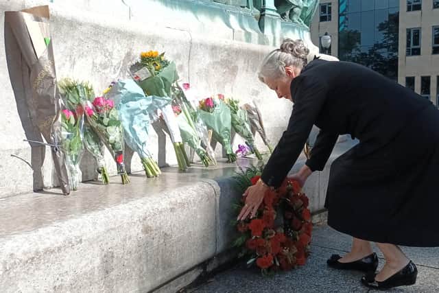 The Mayor of Lancaster lays flowers at Lancaster Town Hall.
