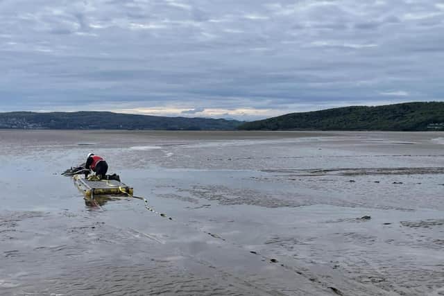 Inflatable pathways had to be crawled on to rescue the bike which was stuck in the quicksand in Morecambe Bay.