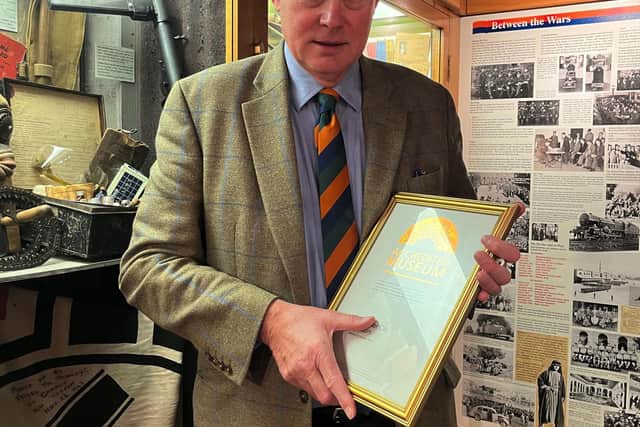 Robin Ashcroft, chair of trustees, with the accreditation in the King’s Own Royal Regiment Museum. Photo: The King’s Own Royal Regiment Museum Trust