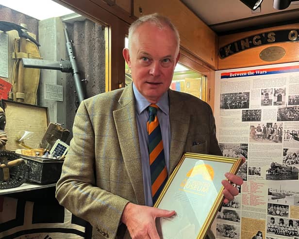 Robin Ashcroft, chair of trustees, with the accreditation in the King’s Own Royal Regiment Museum. Photo: The King’s Own Royal Regiment Museum Trust