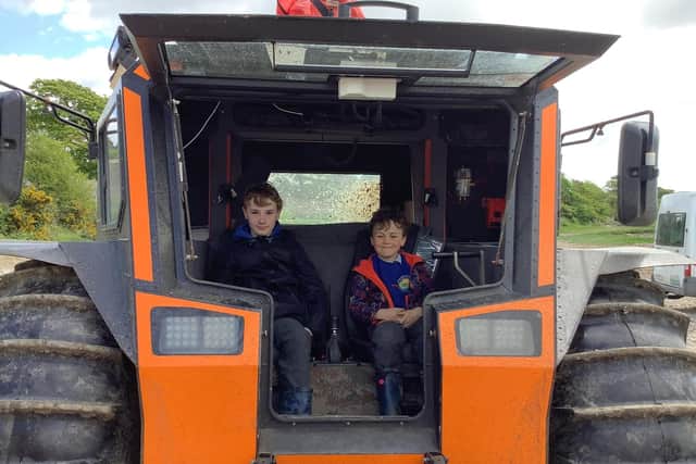 Silverdale St John's pupils enjoy a ride on the new rescue vehicle.