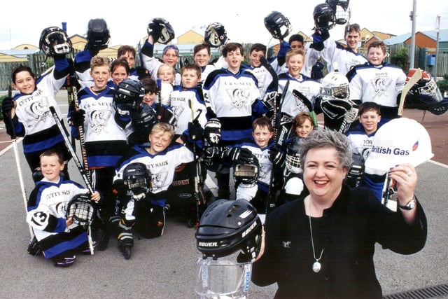 Winning combination: British Gas community relations adviser Collette Handley is pictured with some of the Fleetwood Cobras street hockey squad