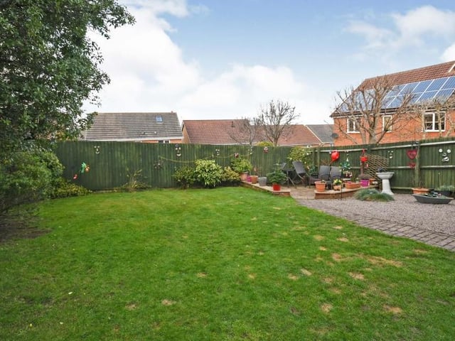 Our final photo of the Forest Town property shows the extensive and enclosed garden at the back. It's a really versatile space with a patio/seating area, as well as a lawn, plants and shrubs.