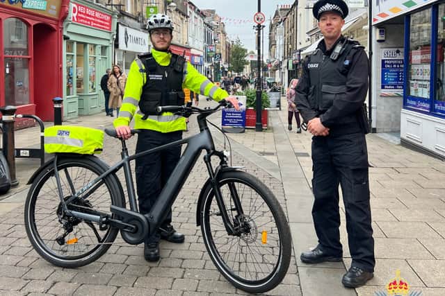 Lancaster Town Centre PCSO Tom Caldicott (left), and Lancaster's Neighbourhood Sergeant Richard Tredennick with a new electronic bike.