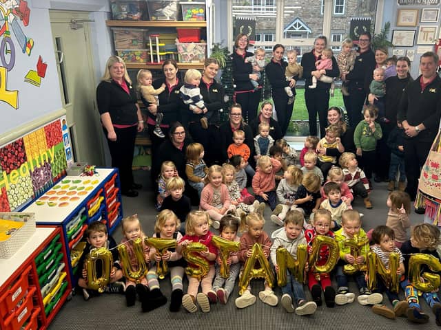 Staff and children celebrate their Ofsted result at Hornby Day Nursery.