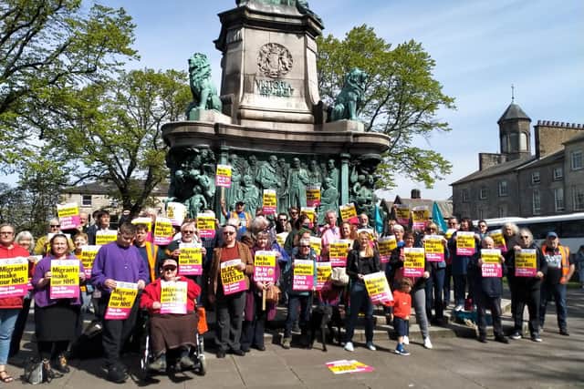 May Day march participants in Dalton Square, Lancaster.