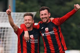 Paul Lewis (right) has scored twice this season for Morecambe
