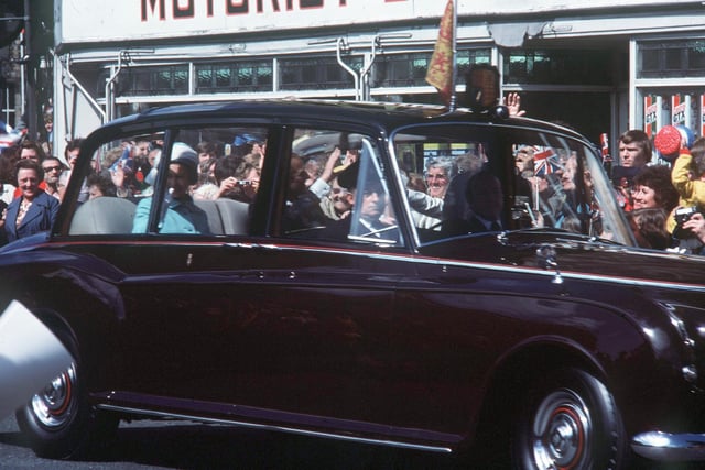 The Queen and Prince Philip wave to the crowds in Lancaster from the royal car. From Mr R Walker, Slyne.