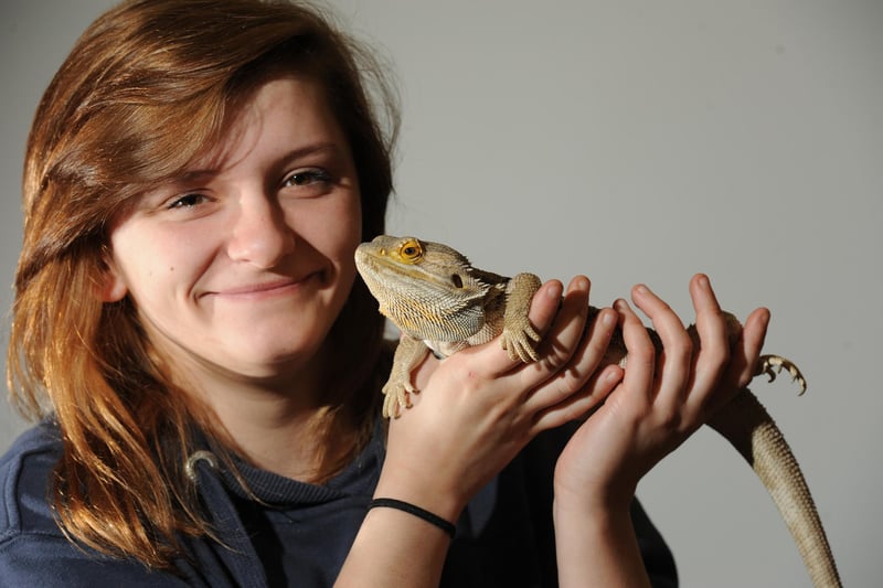 Amy Blezard with Bob, a bearded dragon from Animal Welfare, at Lancaster and Morecambe College