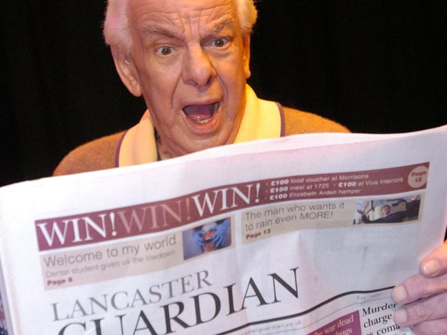 Comedy legend Barry Cryer takes time out to read the Lancaster Guardian during his visit to the Grand.