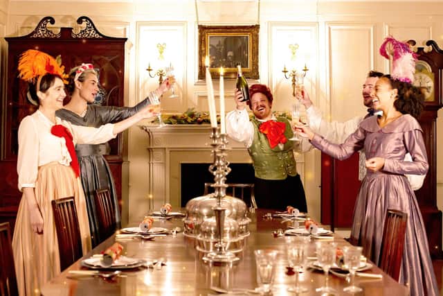A dinner party in A Christmas Carol to be performed at The Dukes in Lancaster. Picture by Gabi Dawkins.