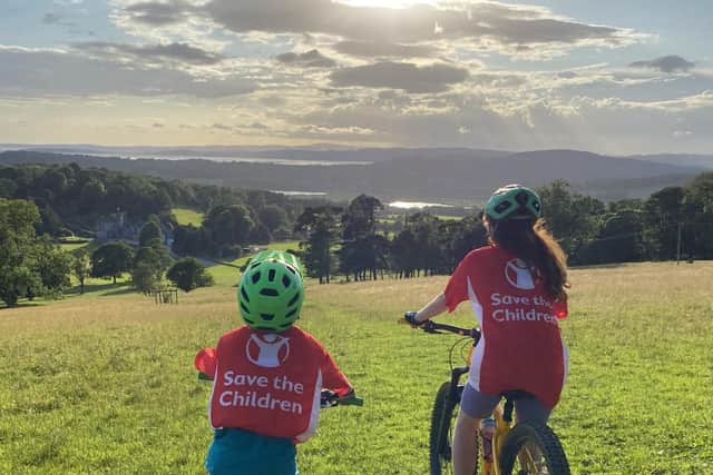 Nicole and Luca ride off into the sunset on their charity mountain biking challenge.