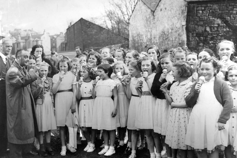 Pupils of St Luke's School in Lancaster enjoy ice creams on the Easter field at the Giant Axe, during the 1950s.