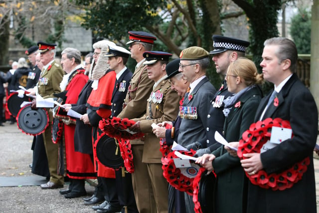 Dignitaries line up with poppy wreaths on Remembrance Sunday in Lancaster.