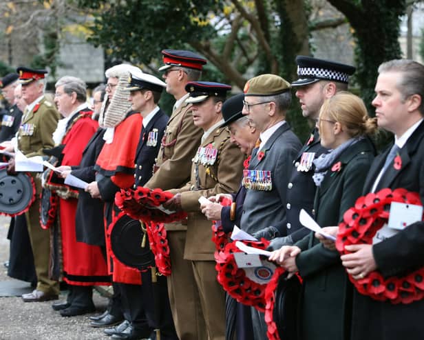 Dignitaries line up with poppy wreaths on Remembrance Sunday in Lancaster.