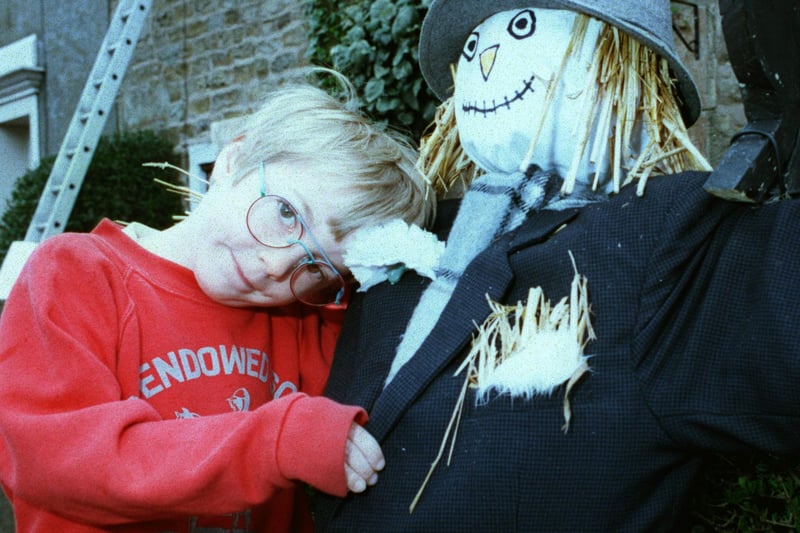 Five-year-old Joe Bowman with his scarecrow Fred at the 1996 Wray Scarecrow Festival.