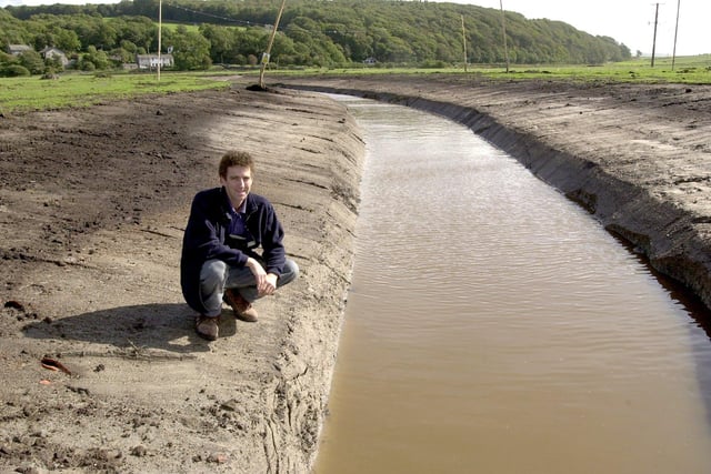 Robin Horner, Site Manager of Leighton Moss Nature Reserve, poses by a new ditch dug as part of a reed planting scheme.