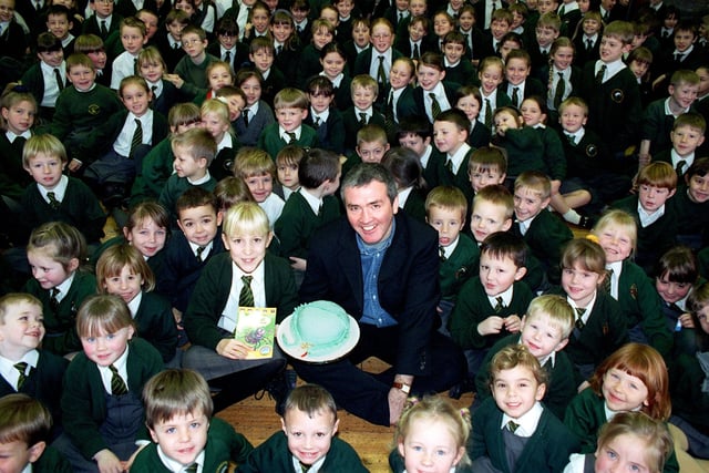 Children's author Tony Bradman visited Shakespeare School in Fleetwood after pupil Rachel Bamber, 10, wrote a letter to him. The children found out that it was Tony's birthday just before his visit, and so presented him with a cake. Picture shows Tony and Rachel (centre) surrounded by admiring fans