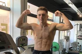 Morecambe boxer Nelson Birchall flexes his muscles before his professional debut in a match in December.