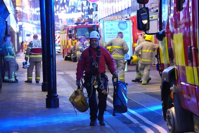 Firefighters at the scene after they were called to a blaze at Blackpool Tower which was actually "orange netting".
