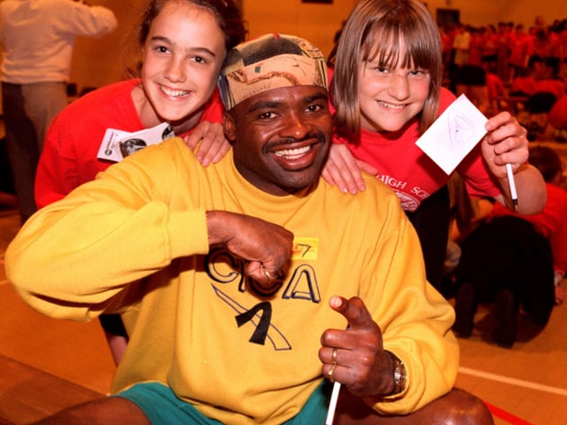 Autograph hunters Caroline Rayner (left) and Claire Perkins met up with former Olympic athlete Kris Akabusi when he visited Morecambe High School to join in with pupils for a fitness morning.
